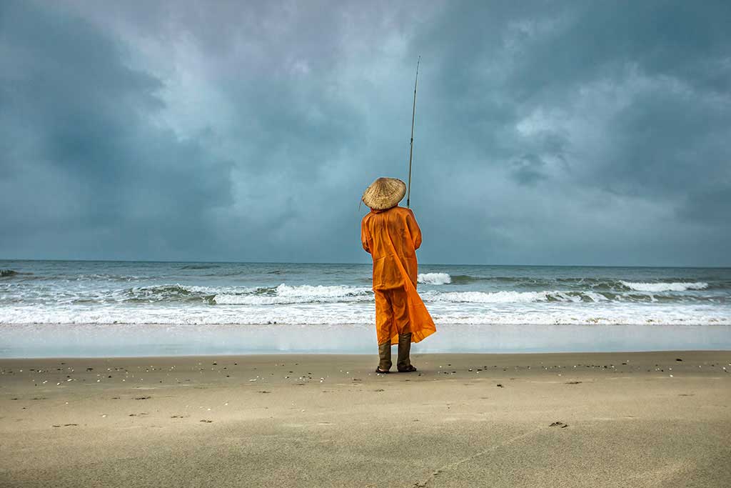 an old man fishing in Vietnam 