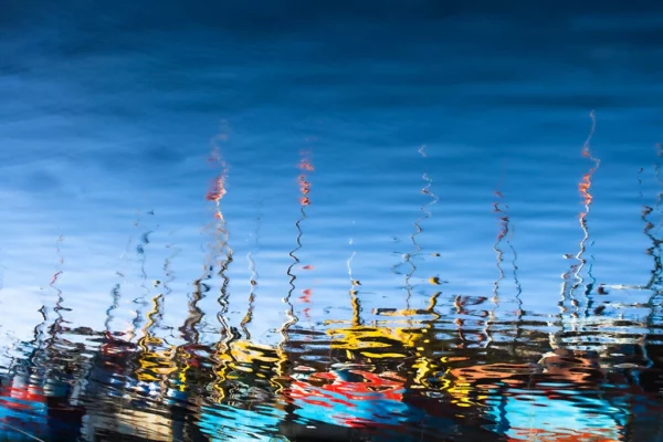 Impressionist photography of the boats in Hoi An with water reflection by Rehahn